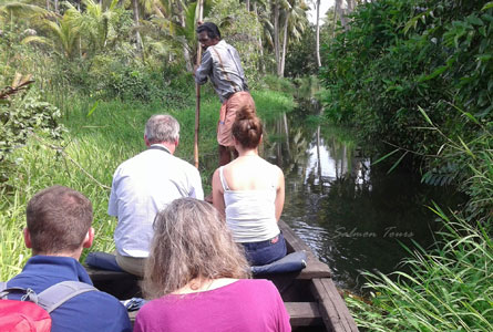 Guest traveling on country boat in Poothotta Backwater